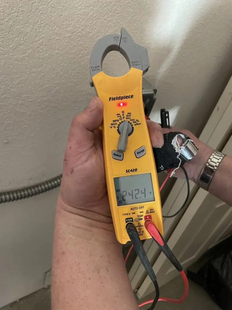Voltage testing with clamp meter during Electrical Installation Services in Schererville